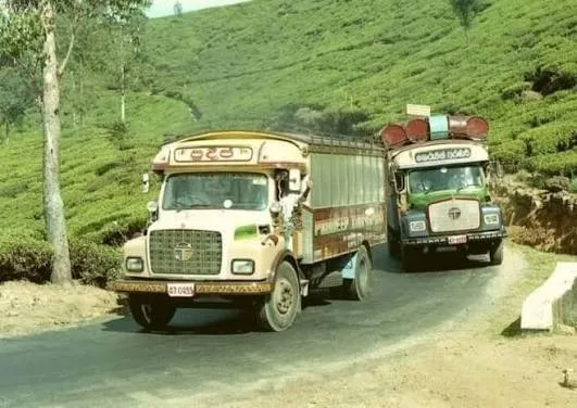Lorries carrying freshly plucked tea leaf down from a Ceylon estate